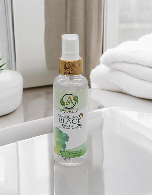Load image into Gallery viewer, Protect &amp; Detangle: Jamaican Black Castor Oil Heat Protectant Spray &amp; Hair Detangler 3.5 oz
