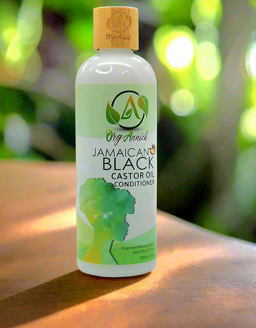 Load image into Gallery viewer, Nourish &amp; Flourish Jamaican Black Castor Oil Conditioner: Nature&#39;s Secret to Healthy Hair - 10oz
